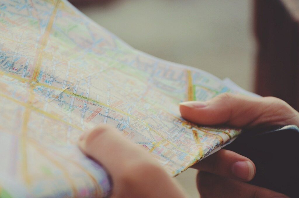 zoomed in photo of a person holding a map