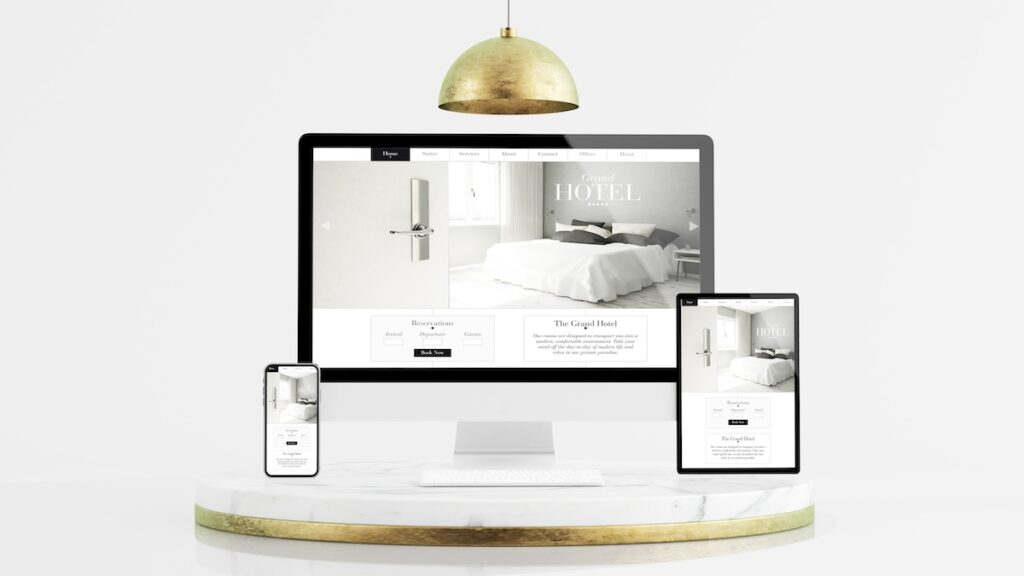 A hotel website displaying responsively on a computer, mobile phone, and a tablet device.