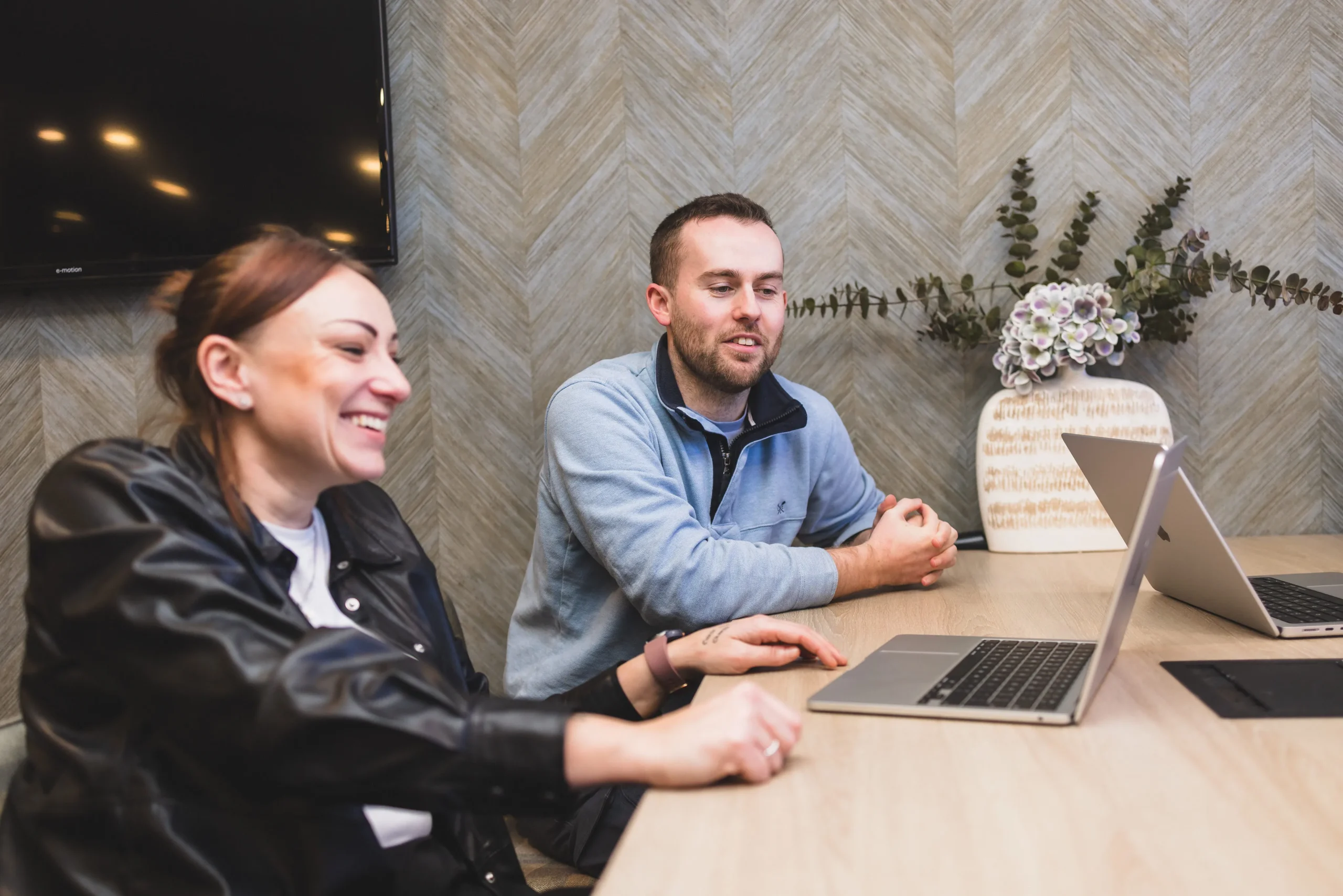 Josh and Gemma collaborating at a table