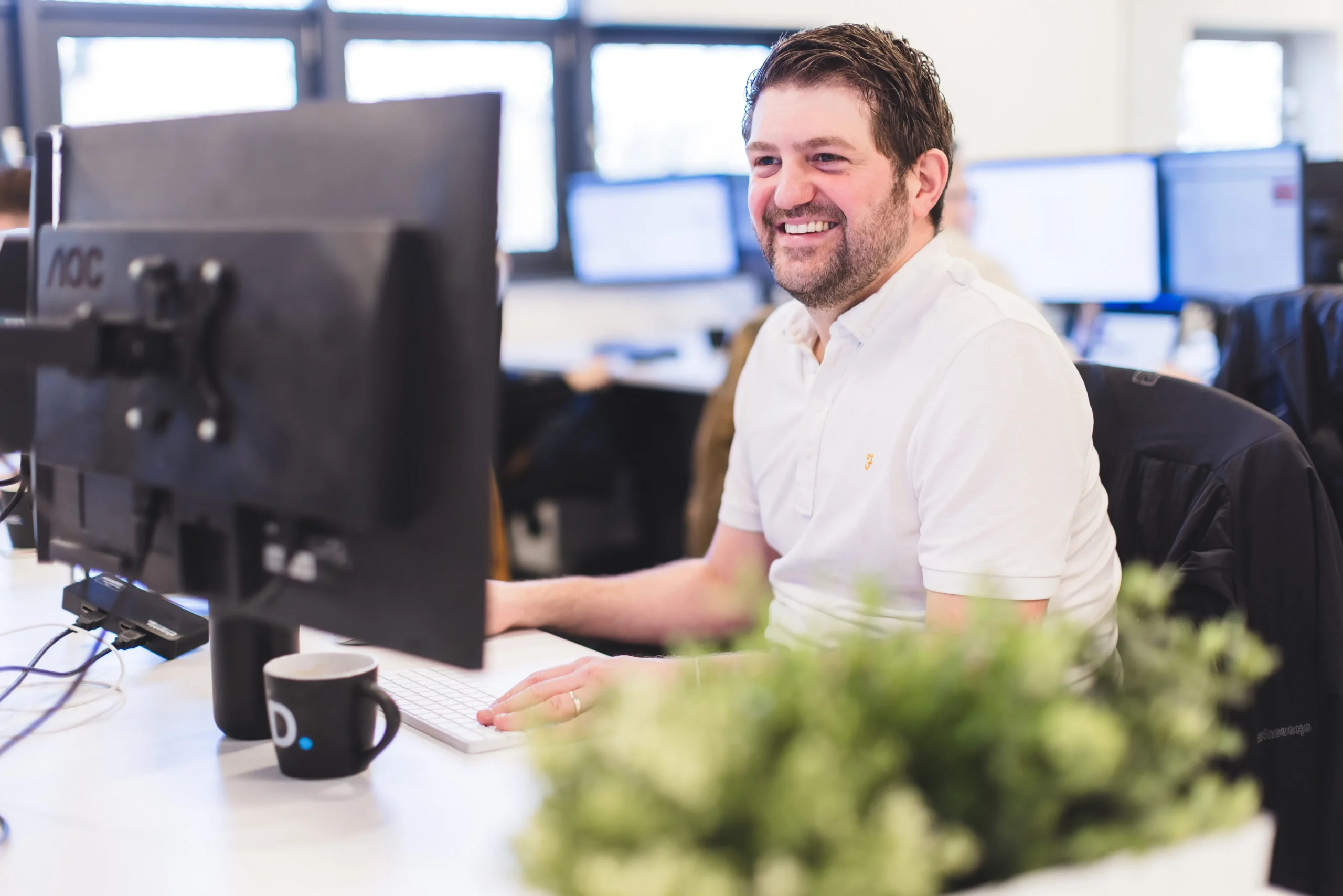 Glenn working at his desk