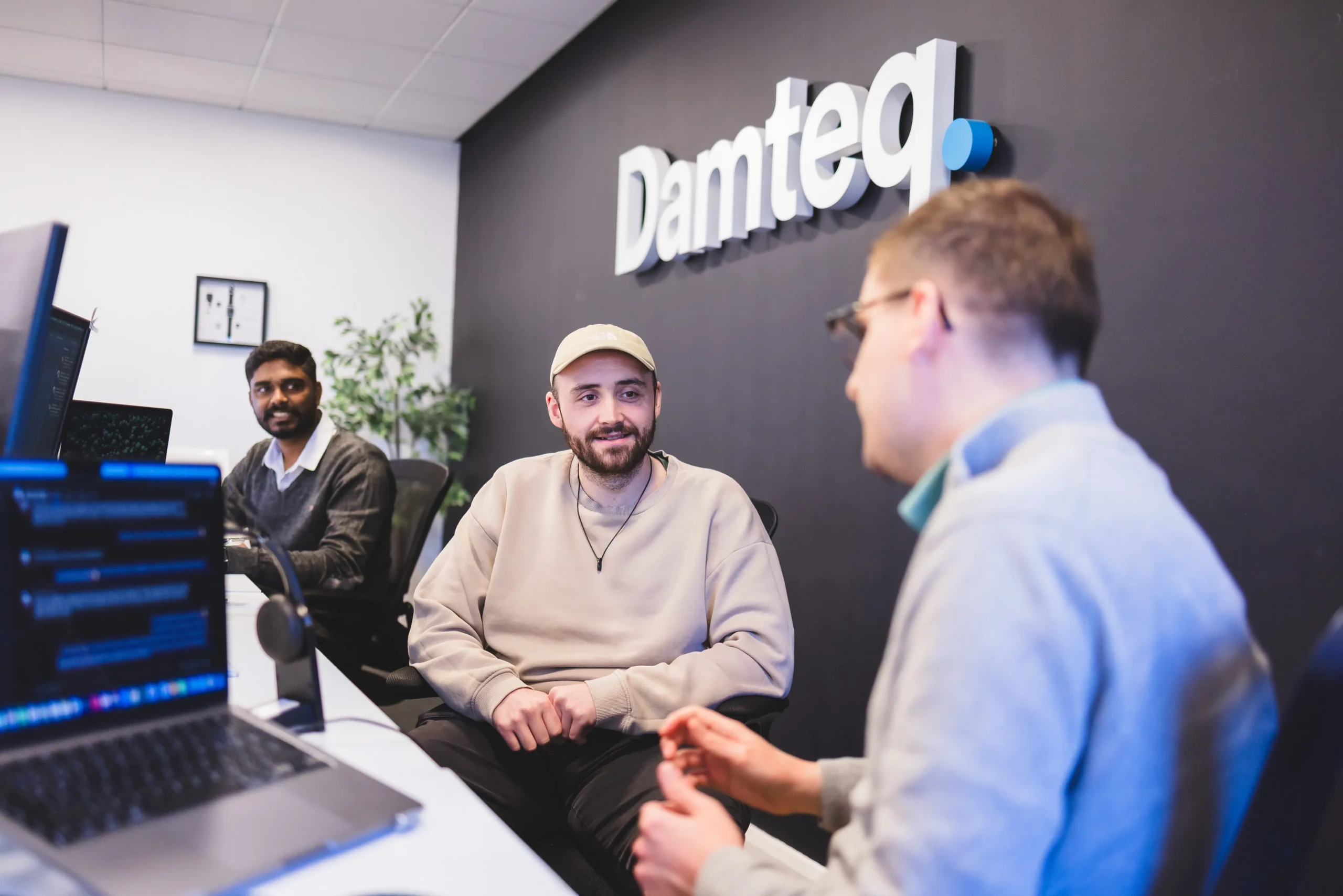 The PPC team collaborating at their desks