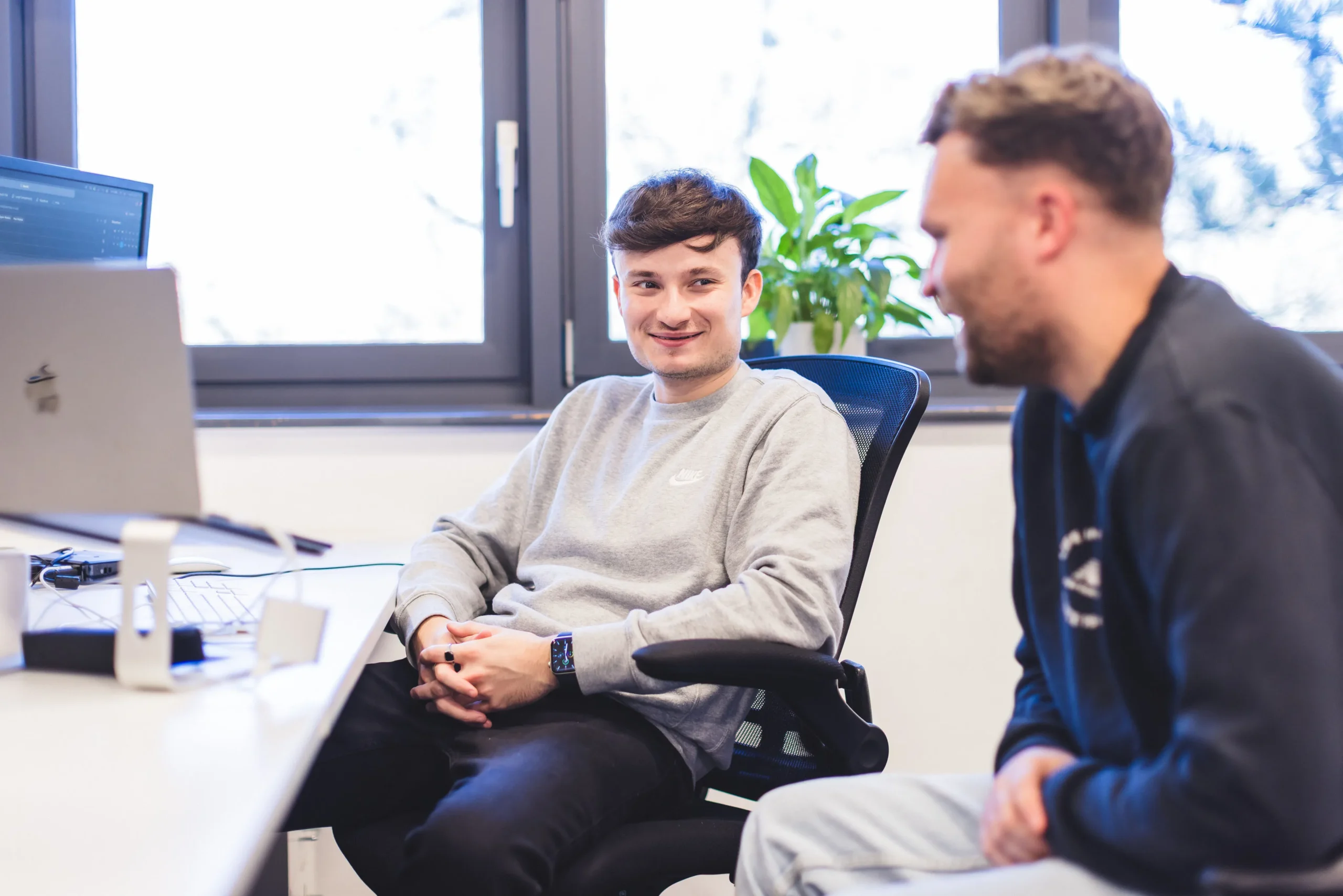 Ryan and Nick collaborating at their desk