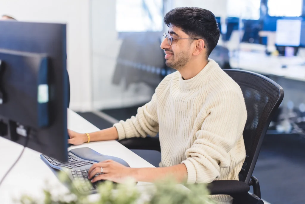 Sajan working at his desk