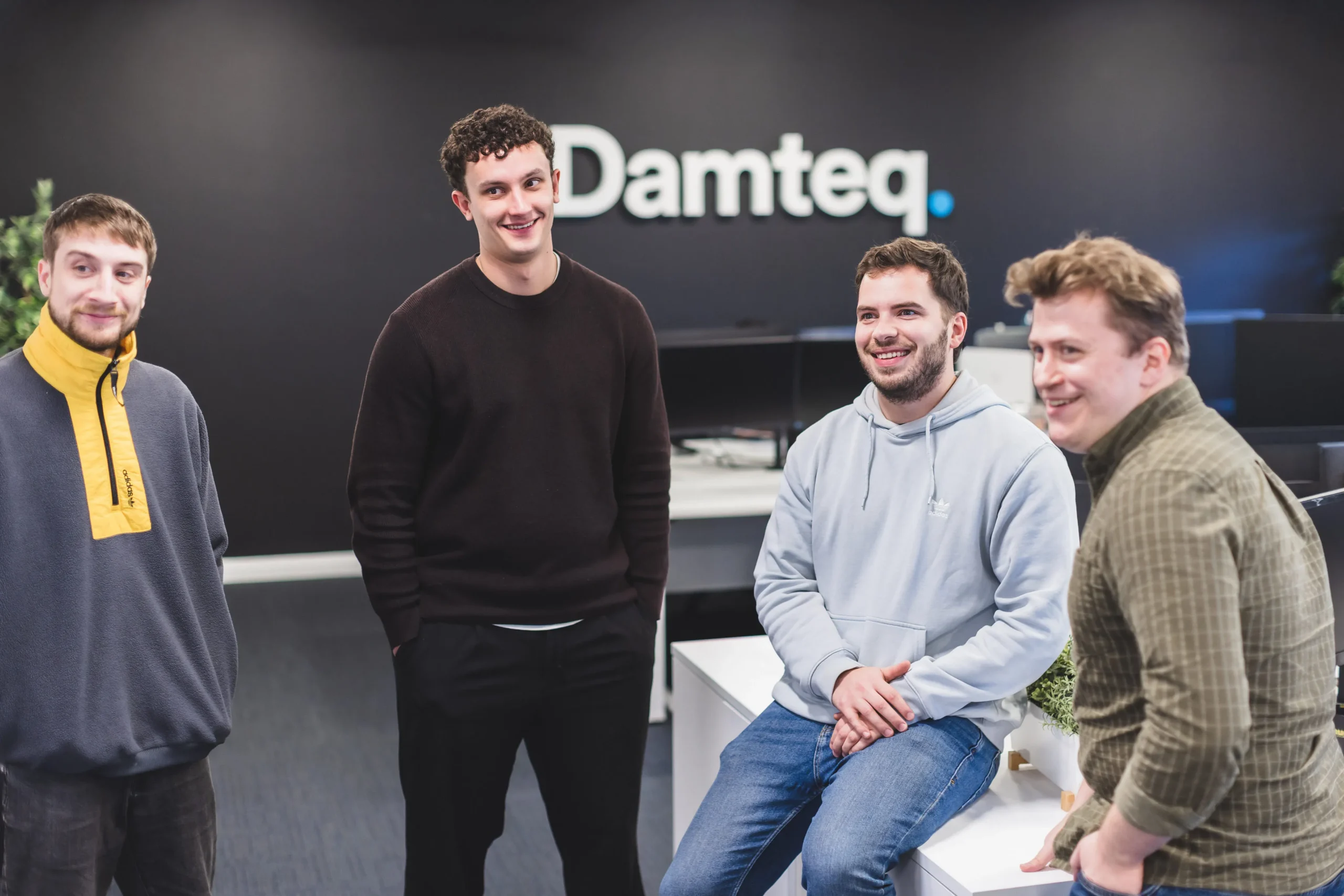 Web and SEO team members stood talking