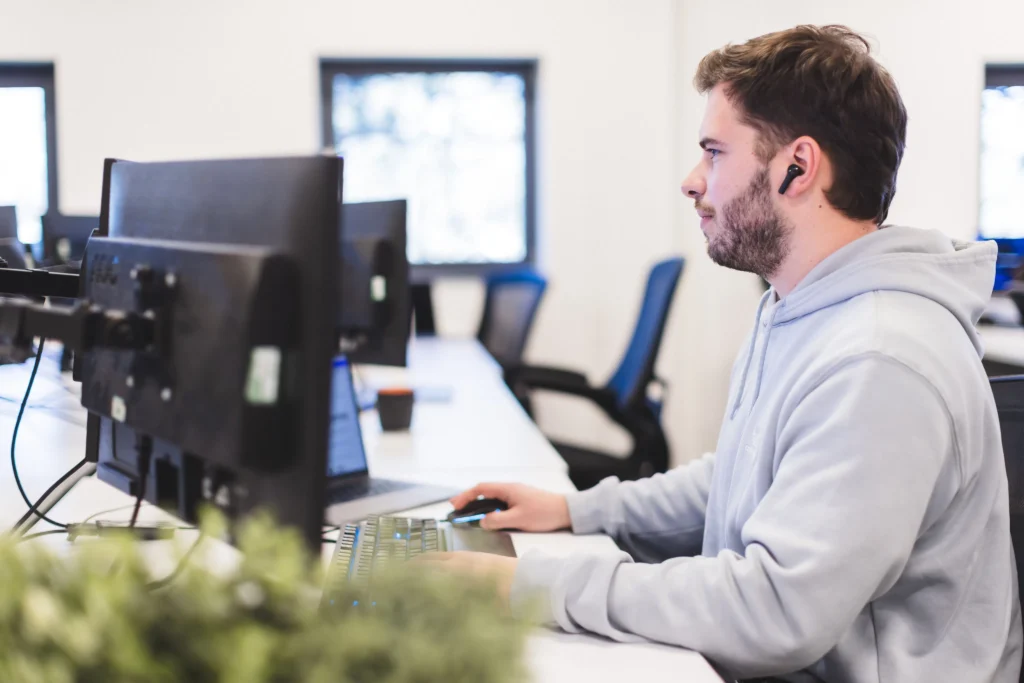 Tom sat at his desk working